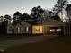 Traditional home featuring white siding, black shutters, a covered carport, and a well-manicured lawn at 132 Crystal Pl, Benson, NC 27504