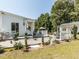 Home exterior featuring a large deck, manicured lawn, and inviting decor, perfect for outdoor living and curb appeal at 132 Crystal Pl, Benson, NC 27504