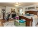 Comfortable main bedroom with a ceiling fan and a large area rug at 132 Crystal Pl, Benson, NC 27504