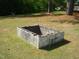 Backyard with a raised cinder block fire pit area at 136 Scramble Rd, Erwin, NC 28339