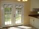Bright dining area with french doors leading to the backyard at 136 Scramble Rd, Erwin, NC 28339