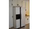 Bright kitchen featuring a modern refrigerator and white cabinets at 136 Scramble Rd, Erwin, NC 28339