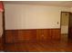 Living room with wood laminate floors and traditional wood-paneled walls at 136 Scramble Rd, Erwin, NC 28339