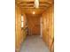 Unfinished shed interior showing the stud construction and potential storage space at 136 Scramble Rd, Erwin, NC 28339