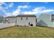 Spacious backyard with a lush lawn and a white privacy fence, perfect for outdoor enjoyment at 138 Tanglewood Pl, Angier, NC 27501