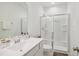 Bathroom with a white vanity, sleek fixtures, and a glass-enclosed shower at 143 Sallyport Ct, Raleigh, NC 27603