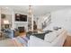 Comfortable living room featuring a fireplace, built-in shelves, and a staircase at 143 Sallyport Ct, Raleigh, NC 27603
