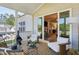 Inviting screened porch features a cozy seating area and seamless indoor-outdoor flow through sliding glass doors at 143 Sallyport Ct, Raleigh, NC 27603