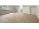 Attic bedroom with built-in shelving and carpeted floor at 145 Brannigan Pl, Cary, NC 27511