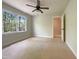Spacious bedroom with large windows providing abundant natural light and ceiling fan at 145 Brannigan Pl, Cary, NC 27511