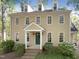 Charming two-story home features a green front door, dormer windows, and mature landscaping at 145 Brannigan Pl, Cary, NC 27511
