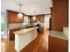 Kitchen featuring a breakfast bar, granite countertops, and stainless steel appliances at 145 Brannigan Pl, Cary, NC 27511