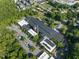 Aerial view of commercial building surrounded by lush green trees and parking at 1535 Caraleigh Mills Ct # 104, Raleigh, NC 27603