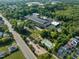 A bird's eye view of apartments, pool, park, and surrounding green trees at 1535 Caraleigh Mills Ct # 104, Raleigh, NC 27603