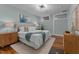 Spacious bedroom features hardwood floors, ample natural light, and stylish decor at 1535 Caraleigh Mills Ct # 104, Raleigh, NC 27603