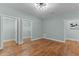 Bright bedroom with hardwood floors and natural light flowing through the room at 1535 Caraleigh Mills Ct # 104, Raleigh, NC 27603