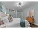Bedroom with hardwood floors, modern lighting, and a decorative accent wall at 1535 Caraleigh Mills Ct # 104, Raleigh, NC 27603
