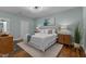 Cozy bedroom with modern lighting, hardwood floors, and a comfortable king bed at 1535 Caraleigh Mills Ct # 104, Raleigh, NC 27603