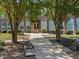 Exterior shot of building featuring brick facade, large arched windows, and benches at 1535 Caraleigh Mills Ct # 104, Raleigh, NC 27603
