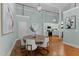 Open-concept dining room and kitchen area with modern light fixtures and wood flooring at 1535 Caraleigh Mills Ct # 104, Raleigh, NC 27603