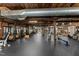 Spacious gym with rubber flooring, exposed ceiling, brick walls, and various exercise equipment at 1535 Caraleigh Mills Ct # 104, Raleigh, NC 27603