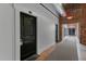 Hallway featuring unique architectural details and natural light at 1535 Caraleigh Mills Ct # 104, Raleigh, NC 27603