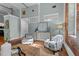 Bright living room features hardwood floors, exposed brick, and elegant decor at 1535 Caraleigh Mills Ct # 104, Raleigh, NC 27603