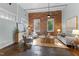 Stylish living room with exposed brick wall, natural light, and comfortable seating at 1535 Caraleigh Mills Ct # 104, Raleigh, NC 27603