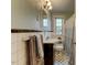 Traditional bathroom featuring a single vanity, a tiled shower with tub, and patterned flooring at 1700 W Front St # 36 D, Burlington, NC 27215