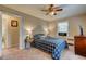 Cozy bedroom with a ceiling fan, window and comfortable bed at 1700 W Front St # 36 D, Burlington, NC 27215
