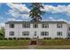 Inviting white brick exterior featuring gray shutters and a well-maintained lawn at 1700 W Front St # 36 D, Burlington, NC 27215