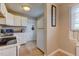 Well-lit kitchen with white cabinetry and essential appliances at 1700 W Front St # 36 D, Burlington, NC 27215