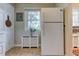 Bright kitchen features white appliances, neutral walls, and window over sink area at 1700 W Front St # 36 D, Burlington, NC 27215