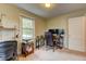 Bright office room showcasing a desk, office chairs, and natural light from a window at 1700 W Front St # 36 D, Burlington, NC 27215