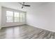 Spacious bedroom featuring large windows and modern flooring at 1817 Shady Oaks Dr, Wendell, NC 27591