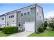This attractive townhome boasts an attached garage, private driveway, and manicured landscaping for curb appeal at 1817 Shady Oaks Dr, Wendell, NC 27591