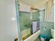 Full bathroom featuring a shower-tub combination with sliding glass doors at 1829 Stewart Farm Rd, Henderson, NC 27537