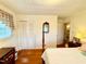 Bedroom featuring hardwood floors, a window, and access to the bathroom at 1829 Stewart Farm Rd, Henderson, NC 27537
