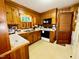 Functional kitchen with wooden cabinets, ample counter space, and modern appliances at 1829 Stewart Farm Rd, Henderson, NC 27537