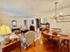 Inviting living room featuring hardwood floors, a dining set, and classic furnishings at 1829 Stewart Farm Rd, Henderson, NC 27537