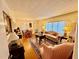 Inviting living room with hardwood floors, large windows and vintage furnishings at 1829 Stewart Farm Rd, Henderson, NC 27537