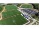 Expansive aerial view of outdoor athletic fields, showcasing well-maintained grounds and ample parking at 1950 Menet St, Apex, NC 27502