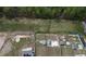 An aerial view showing the lot's position next to woods and other community properties at 1950 Menet St, Apex, NC 27502