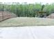 Backyard featuring patio set, a wooden fence and trees for privacy at 1950 Menet St, Apex, NC 27502