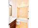 Well-lit bathroom featuring a vanity, toilet, and tiled shower-tub combination at 1950 Menet St, Apex, NC 27502