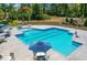 A refreshing community pool with tables and chairs offers a relaxing spot to unwind and socialize with neighbors at 1950 Menet St, Apex, NC 27502