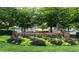 The community sign surrounded by greenery provides an inviting entrance, highlighting the neighborhood's welcoming atmosphere at 1950 Menet St, Apex, NC 27502