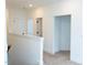 Bright hallway with a view of the rooms, leading to various spaces in the house at 1950 Menet St, Apex, NC 27502