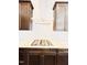 Contemporary kitchen with stainless steel appliances, custom cabinets, and white backsplash at 1950 Menet St, Apex, NC 27502