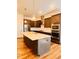 Modern kitchen featuring stainless steel appliances, a large island and white countertops at 1950 Menet St, Apex, NC 27502